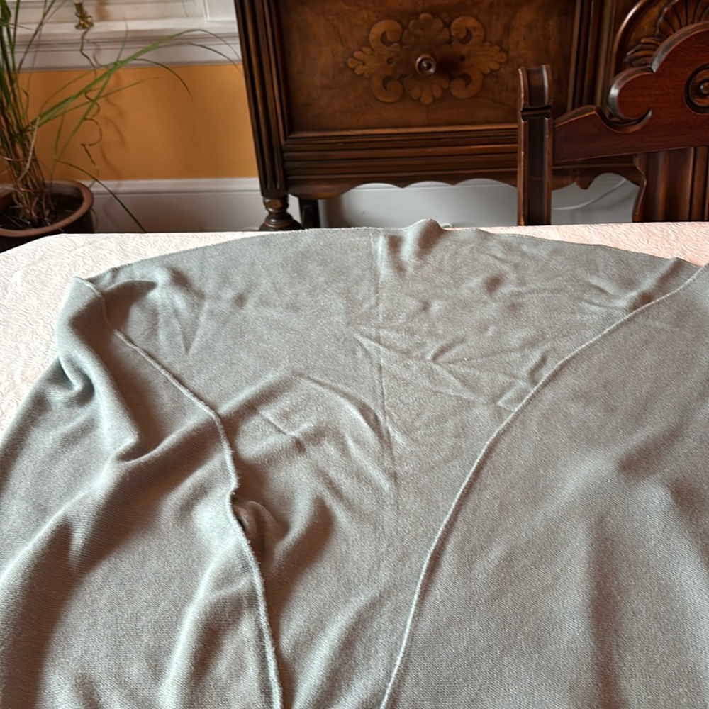 Shrug. Light blue-gray